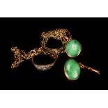 A pair of Chinese jade cuff links, the oval links gold mounted, tamped with maker 'TH', to a '