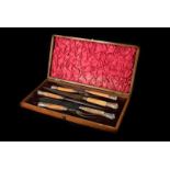 A good Victorian cased antler horn mounted carving set by Harrison Bros & Howson, comprising bread