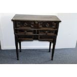 An 18th century Flemish oak sideboard, having hinged top revealing deep well, with candle boxes,