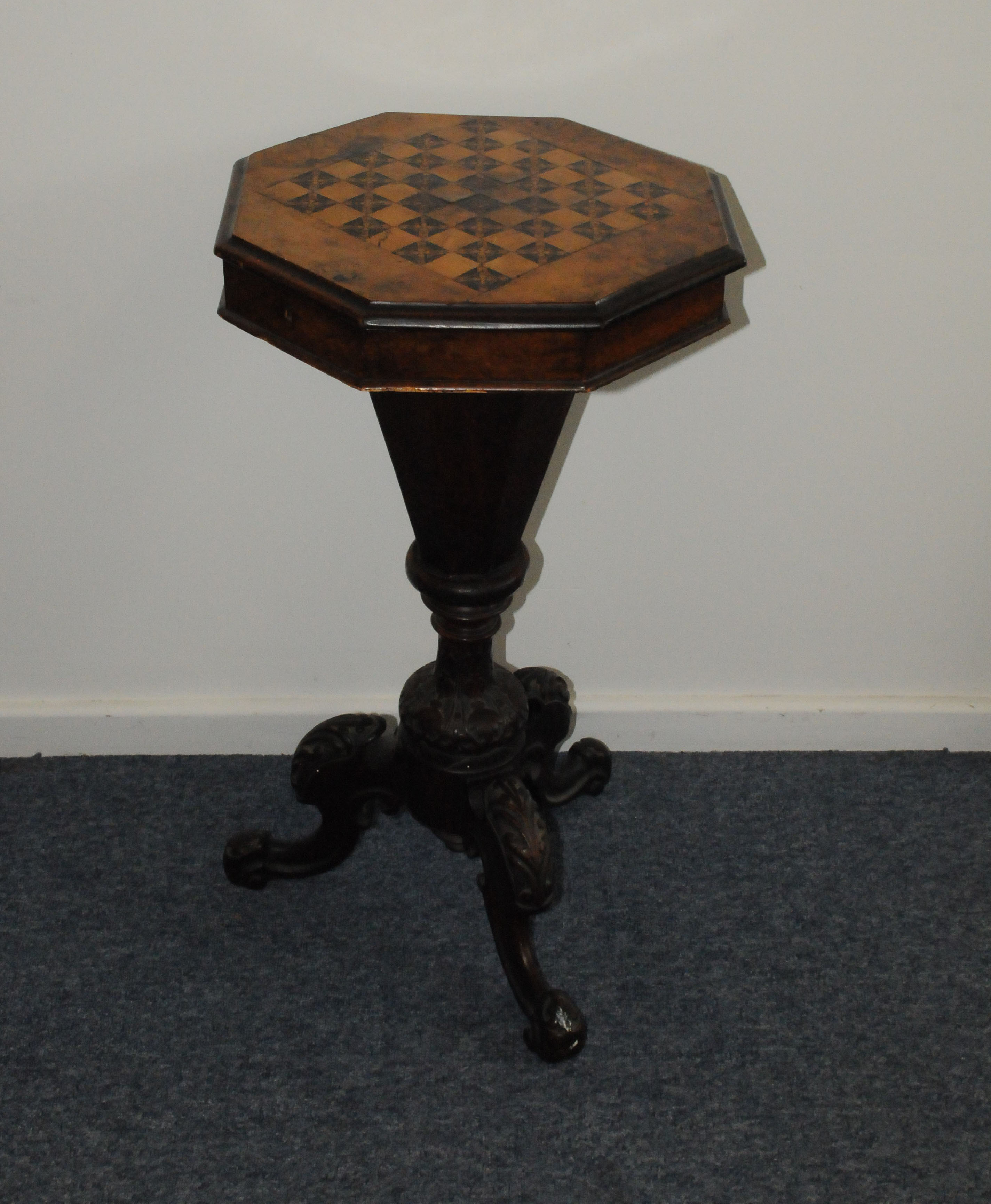 A Victorian walnut and inlaid work table, having chess board inlay to top opening to reveal fitted