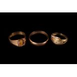 Three 18ct gold and yellow metal rings, including a plain wedding band, a signet ring lacking its