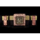 A Hardstone Art Deco Mantle Clock with matching garnitures, with square brushed satin dial and