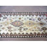 An Art Deco woolen carpet, the 1930s Gabe style rug with cream ground, geometric designs and