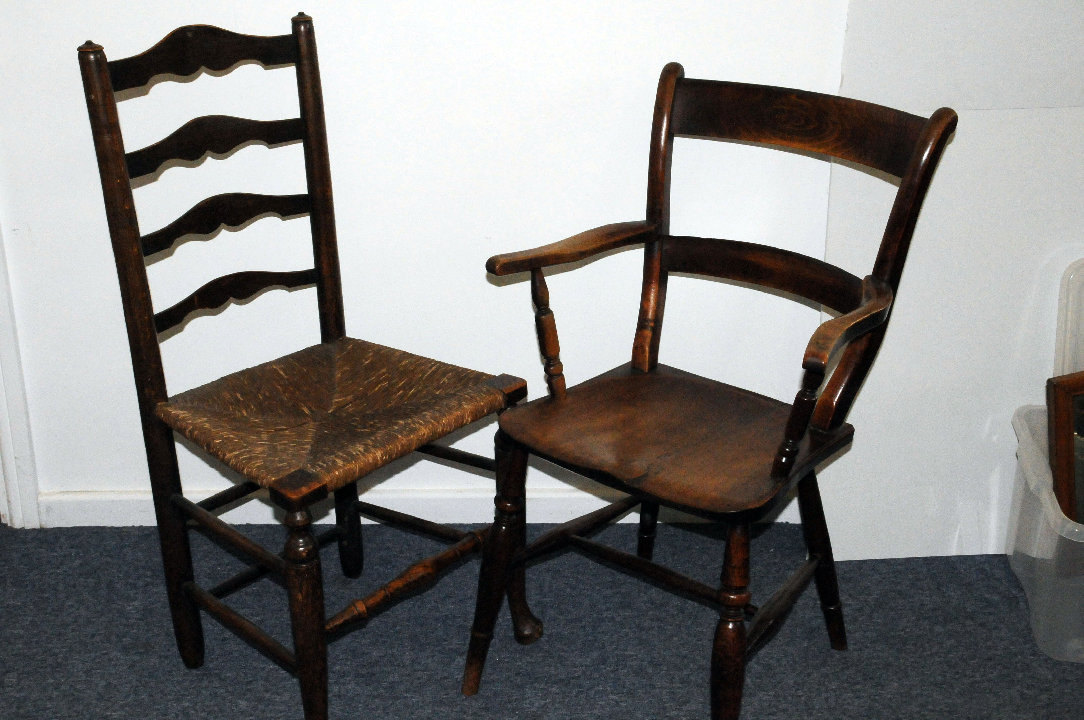 A late Victorian rush seated ladder back chair, together with a Victorian hardwood captains style