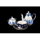 Two Russian porcelain tea sets, both of blue and white pattern with gilt edging, 20 and 22 pieces