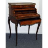 A late 19th century marquetry bonheur du jour, with mechanical cylinder roll above a folding piano