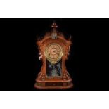 An Ansonia Mantle Clock in mahogany case with inset drawer, paper dial and brass surround,