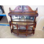 A late Victorian mahogany wall hung mirrored whatnot, having three galleried shelves and broken