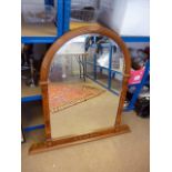 A modern reproduction walnut and inlaid over mantle mirror, having curved pediment and column sides,