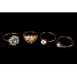 A group of four gold and gem set rings, including an Art Deco 18ct solitaire, a pussy cat ring, a