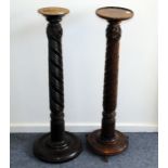 A pair of 19th century or earlier column supports, believed to be from a bed, one now with base