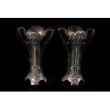 A pair of Art Nouveau white metal vase sleeves, of stylised construction, 14cm high, with makers