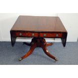 An Edwardian period mahogany sofa table, having drop leaf sides, two drawers to frieze and dummy