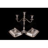 An Edwardian Sheffield plated candelabra, having two branches and central scone on stem support,