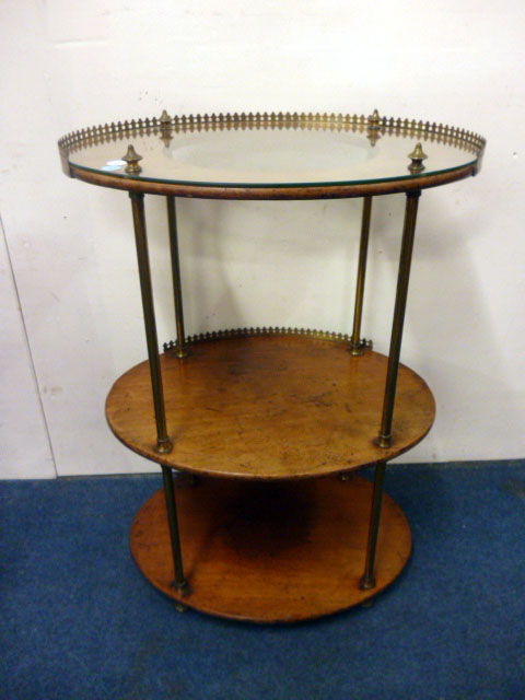 A Victorian mahogany wash stand, the brass galleried shelves separated with brass columns, later