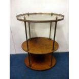 A Victorian mahogany wash stand, the brass galleried shelves separated with brass columns, later
