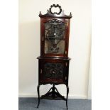 An Edwardian period mahogany corner cabinet, in the rococo taste