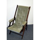 A vintage stained beech and upholstered folding campaign style chair, having light green modern