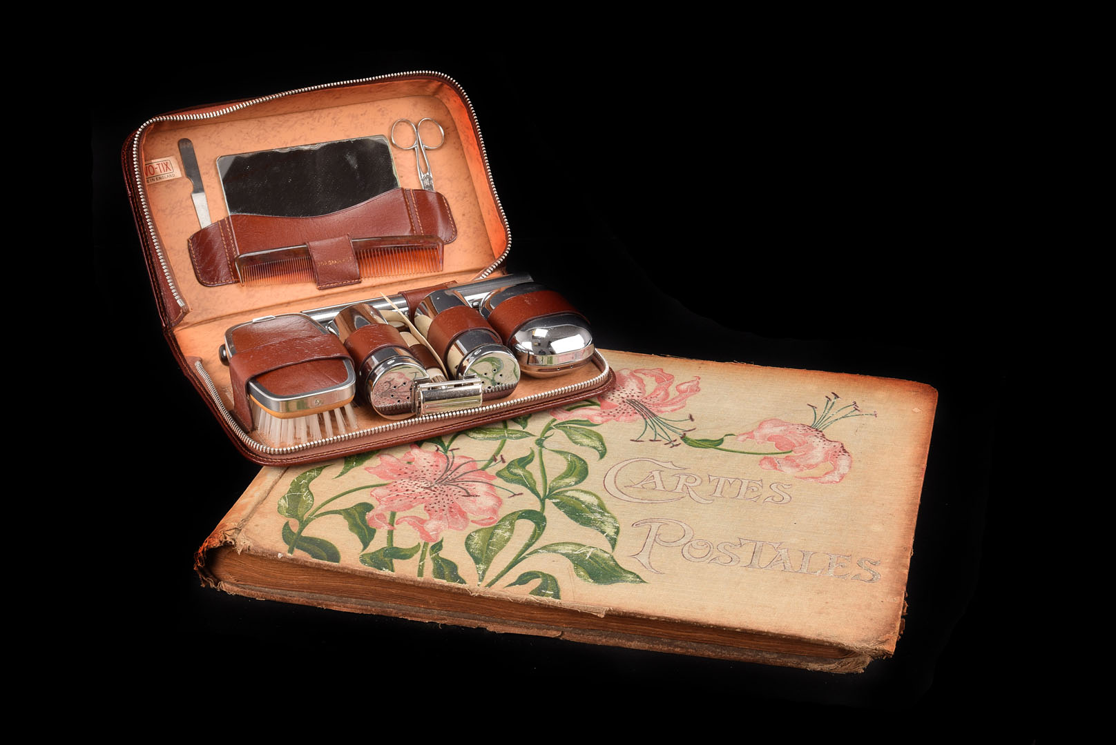 A Gentleman's Two-Tix grooming set, in brown leather zipped case, containing razor, brush and