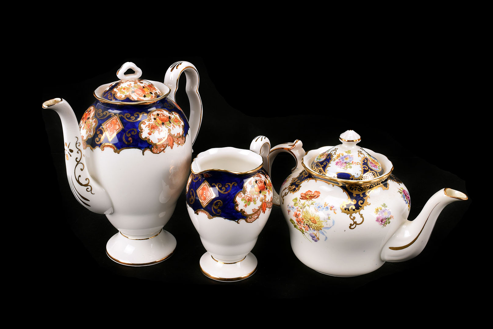 A Mixed floral part tea service, mostly of a blue floral and gilt decoration with items from both