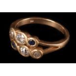 A diamond and sapphire double band ring, the two rows of old brilliants and sapphires in a