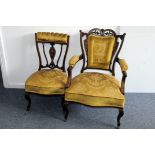 An Edwardian mahogany and inlaid part parlour suite, comprising a chaise longue, arm chair and