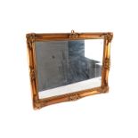 Three 20th Century wall mirrors, 2 in gilt frames and 1 octagonal with faux tortoiseshell frame