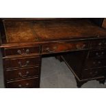 A 20th century mahogany pedastal desk, with leather top, AF