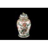 A large Chinese porcelain Famille vert jar and cover, the baluster form base decorated with soldiers
