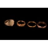 A group of four gold rings, including a 22ct gold band, 3g, an 18ct gold Mizpah ring, 3.3g, a 9ct