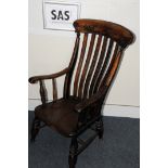 A Victorian armchair, mixed woods with good patina, legs cut short