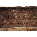 A Persian (possibly Isfahan) rug, of medallion design, with red ground, 208cm, some wear