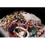 A quantity of costume jewellery, including various beads, bangles, brooches and other items