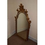 A nice gilt hall mirror, in the rococo taste, with ornate upper and mirrored side panels around