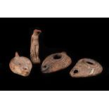 A collection of Middle Eastern Artefacts, including 3 terra cotta oil lamps, small female nude