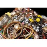 A quantity of costume jewellery, including various beads, bangles, brooches and other items