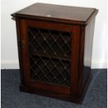 A small 19th century mahogany book cabinet, rectangular form with pierced brass grill to front of