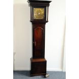 A Georgian oak long case clock, having brass dial with Roman numerals and four classical figures, 30