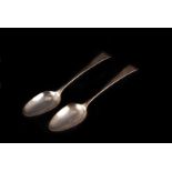A pair of George III silver tablespoons by WS, both plain with engraved initials to terminals for