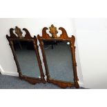 A pair of reproduction Regency Chippendale style mirrors, the fretwork mounts with shell above