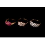 Three modern 9ct gold and gem set dress rings, one having three rows of CZs in bombe cluster, one