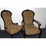 A Victorian mahogany fireside "his and hers" pair of chairs, his with arms, both spoon backs with