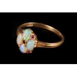 An opal and ruby ring, the opals set in quatrefoil, with ruby accents, central stone missing, to