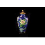 A mid 20th century Chinese cloisonné lamp base, with blue ground and flowers, dented, in card box (