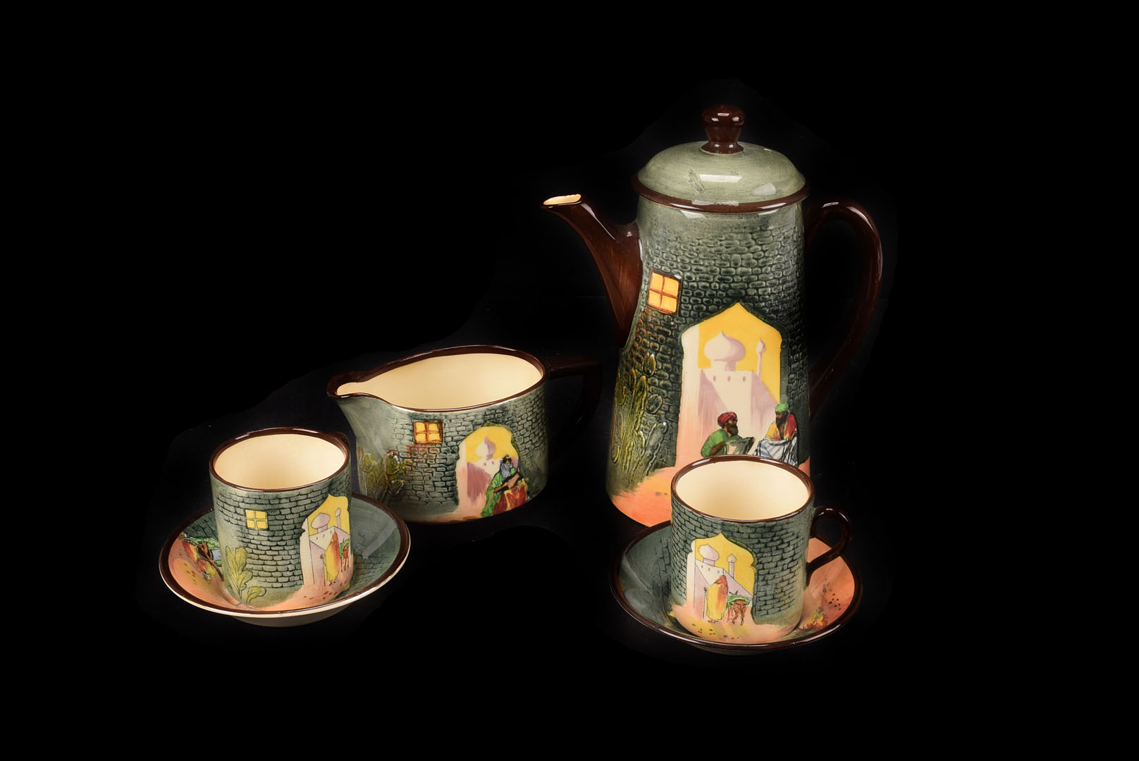 A Royal Doulton Arabian Night Coffee set, with stylised Arabic street seller design in dark rich