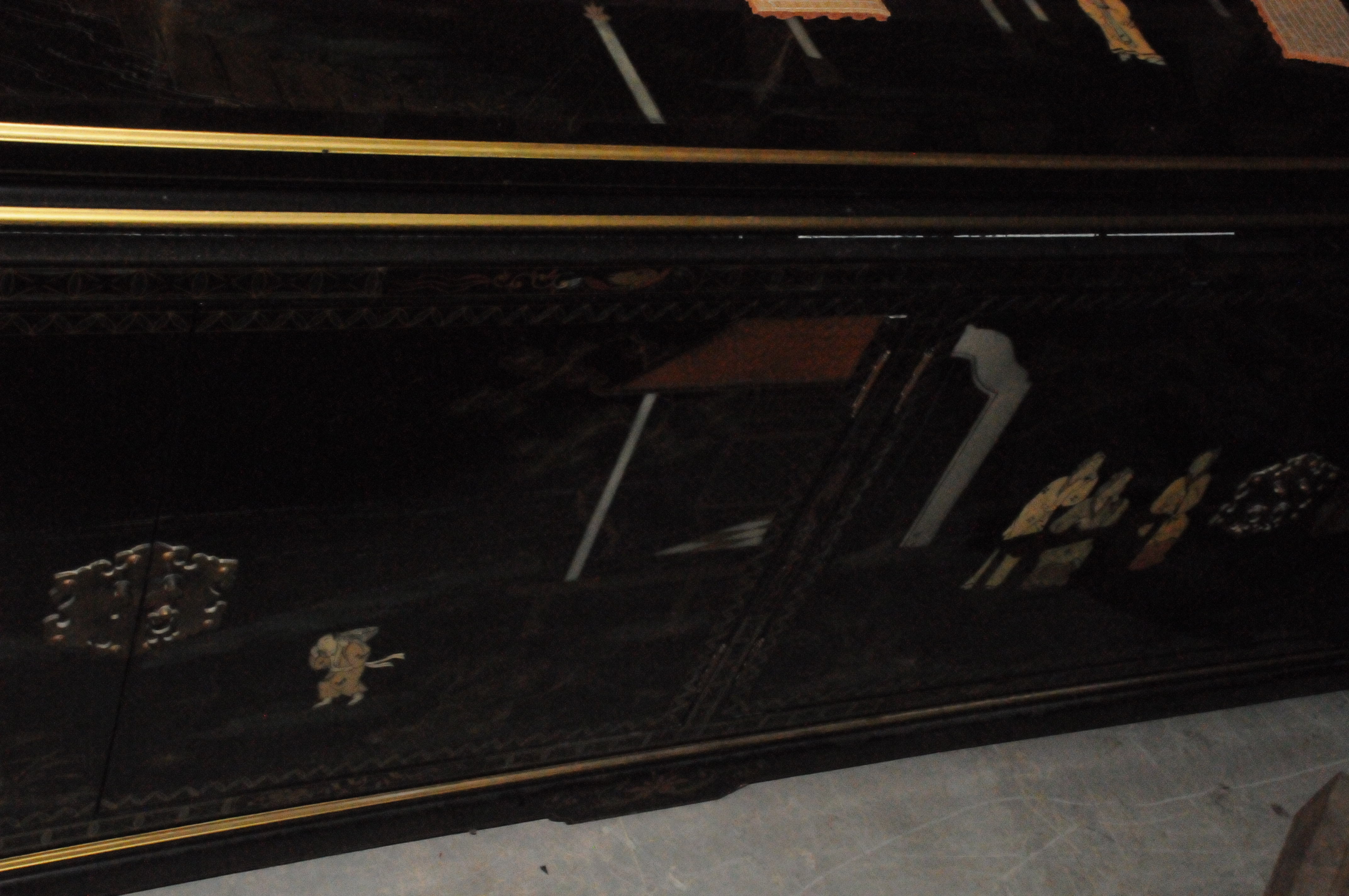 A large modern Chinese lacquered sideboard, with four doors, in black lacquer and heightened in - Image 3 of 3