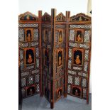 A modern Indian folding dressing screen from Liberty & Co, the four piecred panels with painted