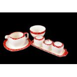 A Part Midwinter Polka Dot Dinner Service, with red borders and white polka dots, consisting of 1