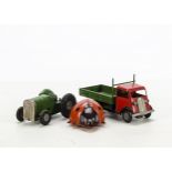 A Tri-ang Minic clockwork ladybird, together with clockwork tractor and open lorry, F-G (3)