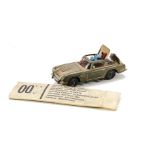 A Corgi James Bond Aston Martin 261, together with secret instructions, lapel badge, additional